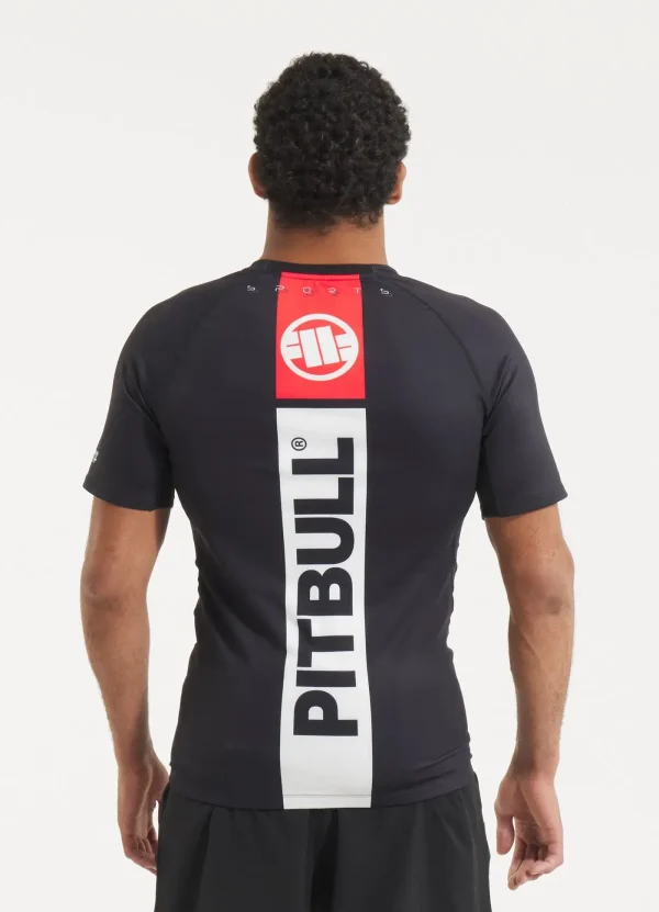 Pitbull Hilltop 2 Rash Guard Black Grey Camo 14 Man wearing a 'Pitbull Hilltop 2 Rash Guard' for extreme sport activities.