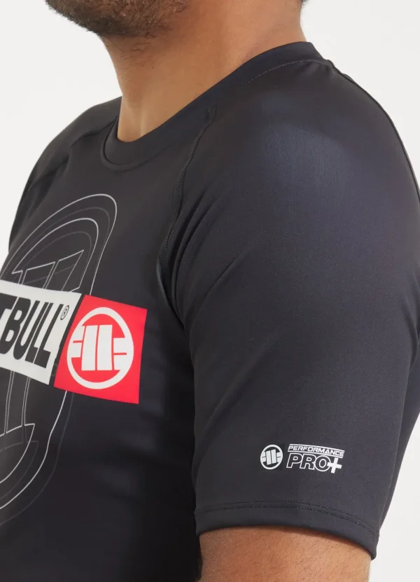 Pitbull Hilltop 2 Rash Guard Black Grey Camo 16 A man wearing the Pitbull Hilltop 2 Rash Guard, designed for athletic and outdoor activities.