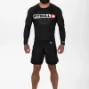 Pitbull Hilltop Sports Longsleeve Rash Guard Black 10 Active male wearing 'Pitbull Hilltop Sports Longsleeve Rash Guard' in an outdoor setting.