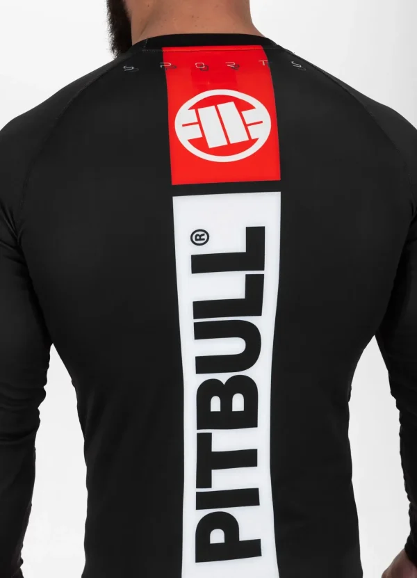 Pitbull Hilltop Sports Longsleeve Rash Guard Black 12 Man wearing Pitbull Hilltop Sports Longsleeve Rash Guard in a gym setting.