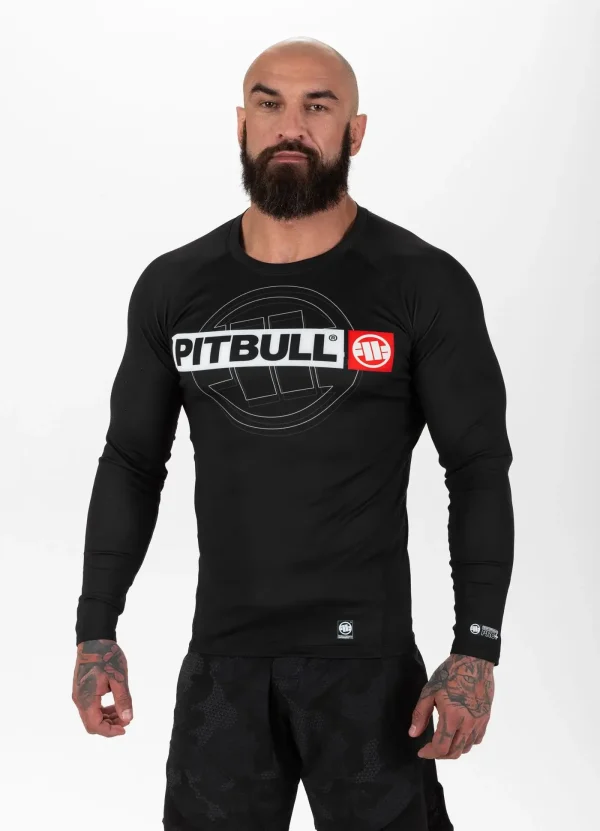 Pitbull Hilltop Sports Longsleeve Rash Guard Black 13 Man wearing Pitbull Hilltop Sports Longsleeve Rash Guard, in a dynamic athletic pose.