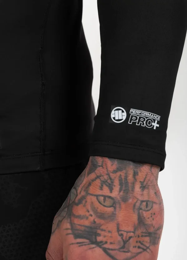 Pitbull Hilltop Sports Longsleeve Rash Guard Black 15 Athletic man wearing Pitbull Hilltop Sports Longsleeve Rash Guard during outdoor training