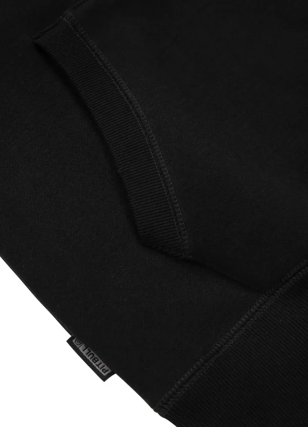 Pitbull Most Wanted Hoodie Black 6 Male model wearing black Pitbull Most Wanted Hoodie with graphic design on front.