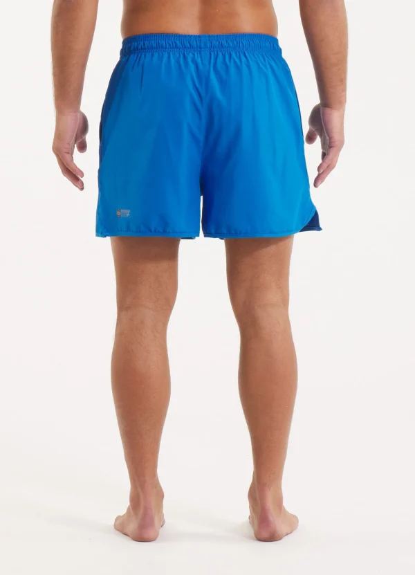 Pitbull Sports Shorts Performance Pro Plus Small Logo Ii Blue 1 Man wearing Pitbull Sports Shorts Performance Pro Plus Small Logo II.