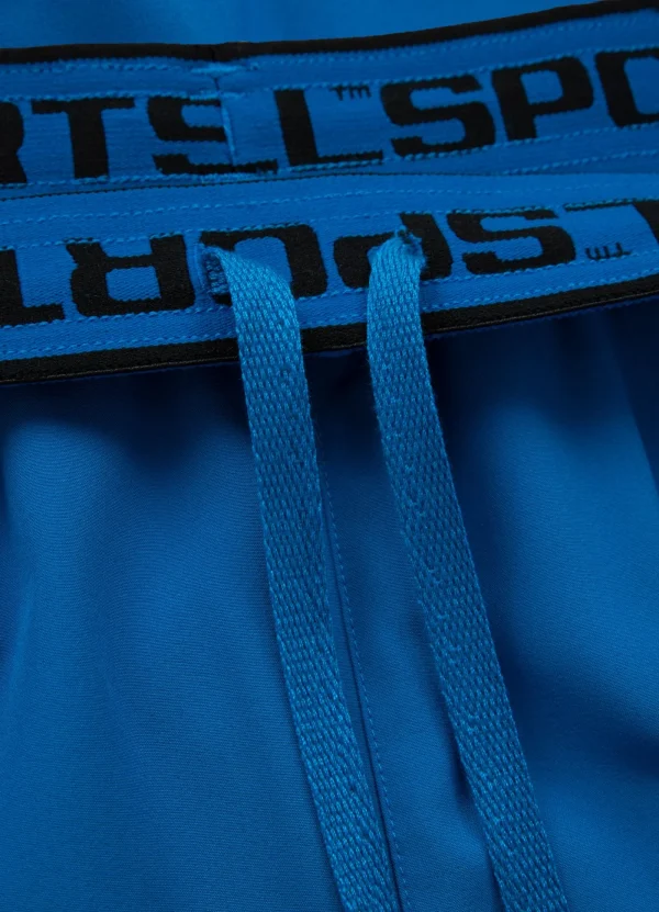 Pitbull Sports Shorts Performance Pro Plus Small Logo Ii Blue 11 A sports enthusiast wearing 'Pitbull Sports Shorts Performance Pro Plus Small Logo II'.