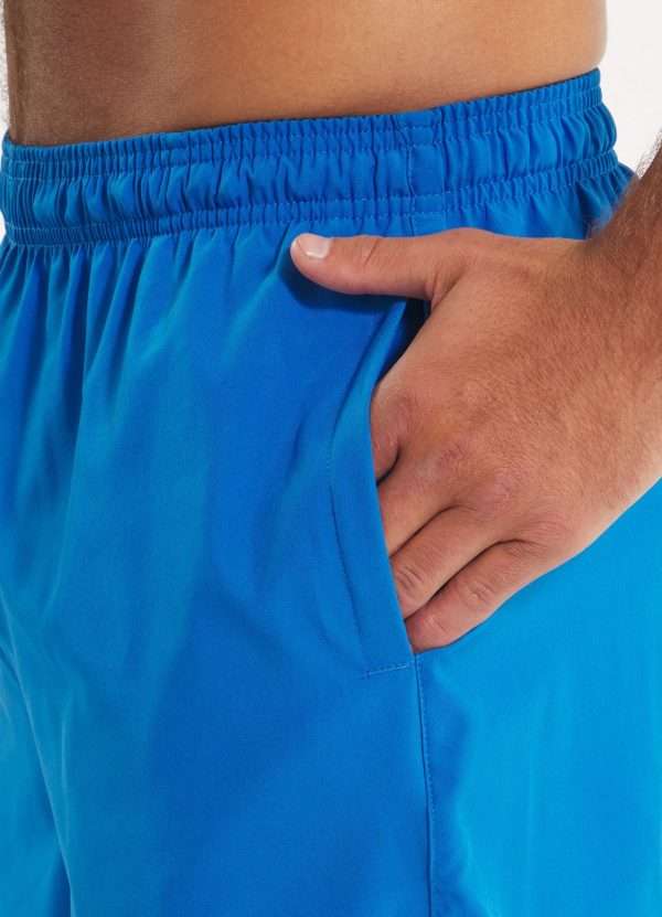 Pitbull Sports Shorts Performance Pro Plus Small Logo Ii Blue 4 Athletic man posing in Pitbull Sports Shorts Performance Pro Plus Small Logo II.