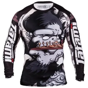 A man wearing 'Tatami Fightwear Chess Gorilla Rash Guard', showcasing an exclusive fight wear for martial arts enthusiasts.