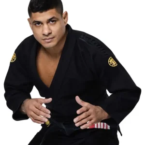 Tatami Fightwear Estilo Gold Label BJJ Gi Man wearing Tatami Fightwear Estilo Gold Label BJJ Gi, posed in a fighting stance.