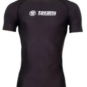 Man wearing the 'Tatami Fightwear Impact Rashguard' during an intense martial arts training session.