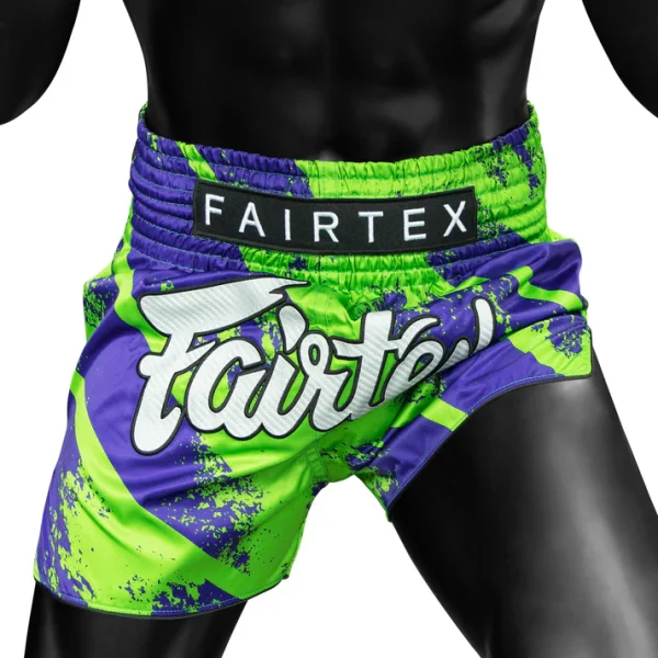Fairtex Street King Muay Thai Shorts Green Blue 2 Fairtex Street King Muay Thai Shorts - Green/Blue in Green/Blue — logo close‑up