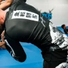 Tatami rash guard action shot