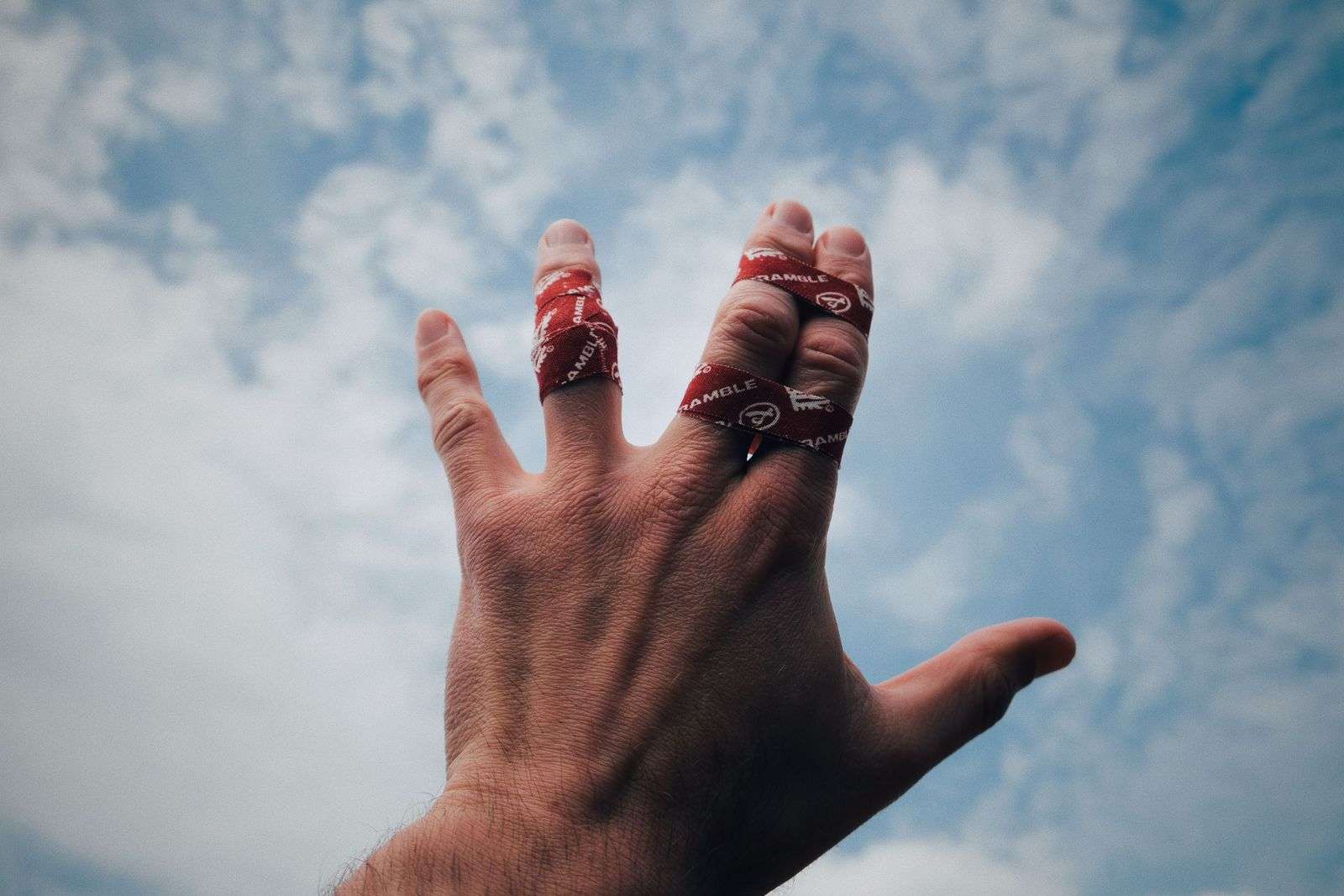 A hand wrapped up in scramble finger tape