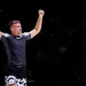 A victorious grappler in the matching scramble Rashguard and shorts baka set