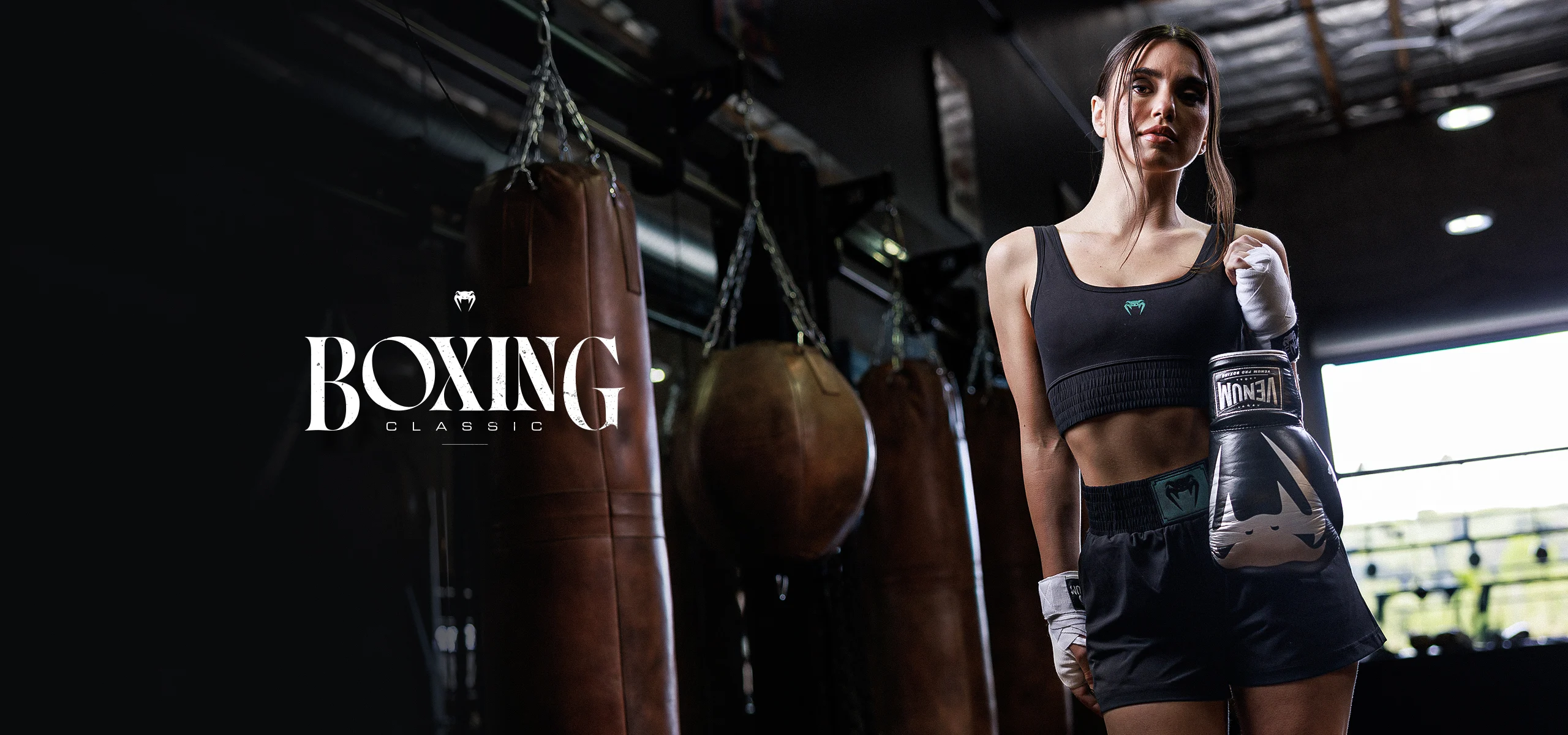 venum_com_boxing-classic_2560x1200 A promotional image for Women's Boxing Boots by Venum