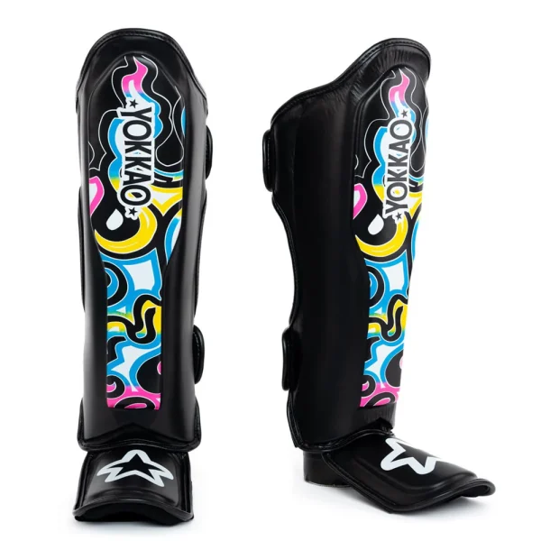 Yokkao Flames Shin Guards Black Multicolour 1 Yokkao Flames Shin guards - Black/Multicolour in Black/Multicolour — graphic close‑up