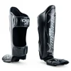 Yokkao Institution Shin Guards - Black in Black — flat lay