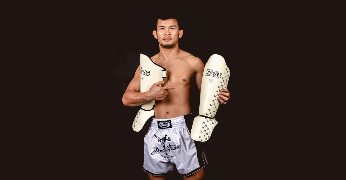 Thai Fighter holding the Fairtex SP5 Shin Protection