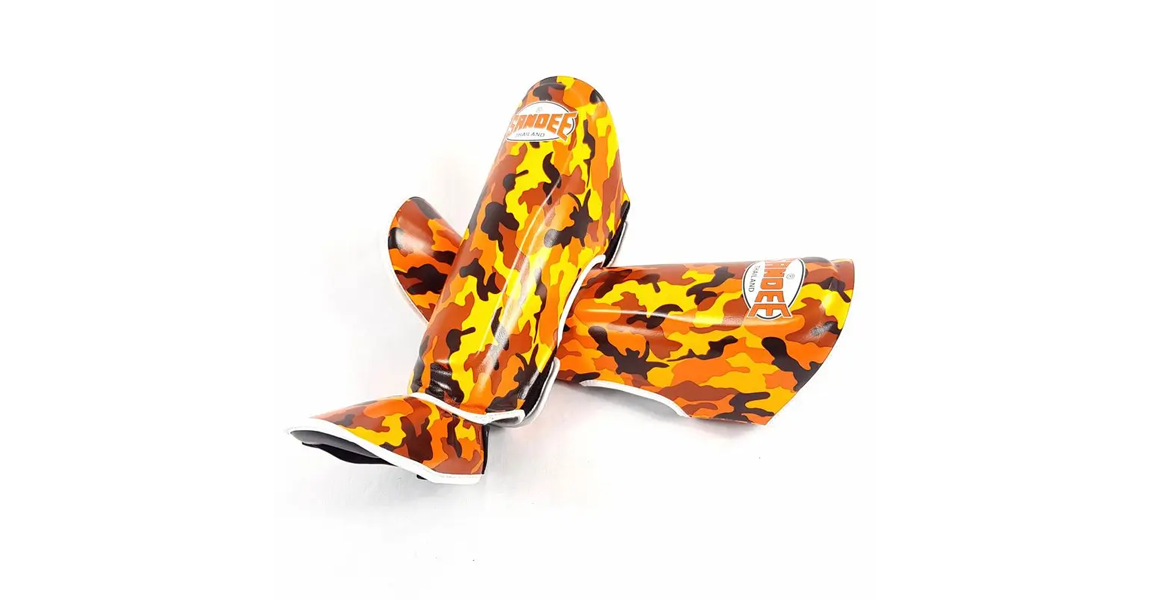 Sandee kids authentic shin guards in orange camo for kickboxing and Muay Thai.