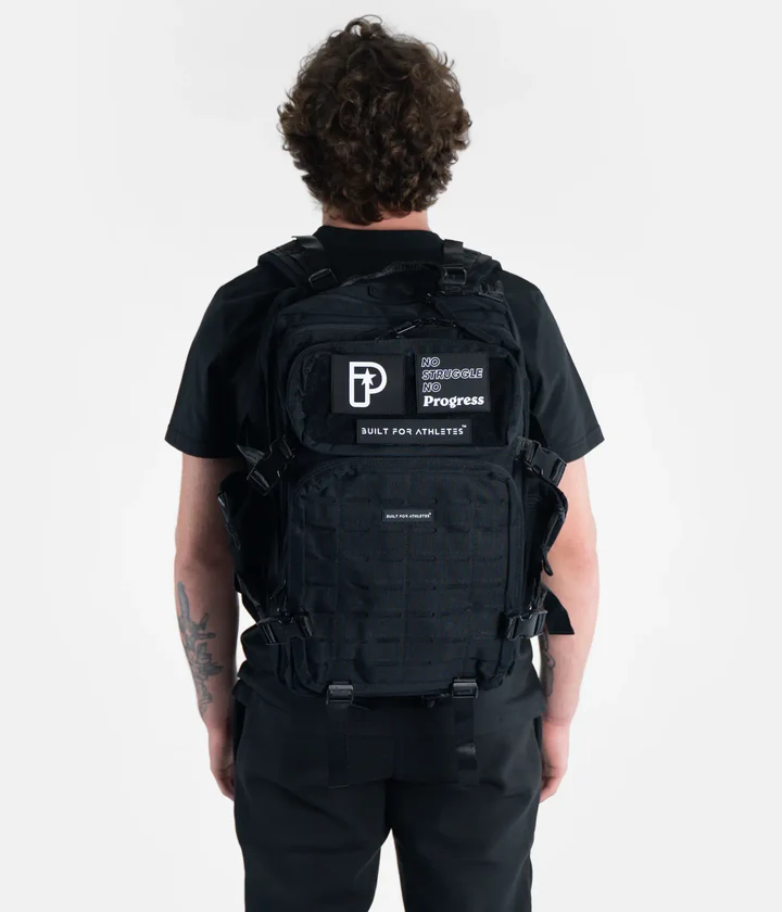 A collection of essential fight gear accessories including a kit bag, water bottle, and boxing timer.