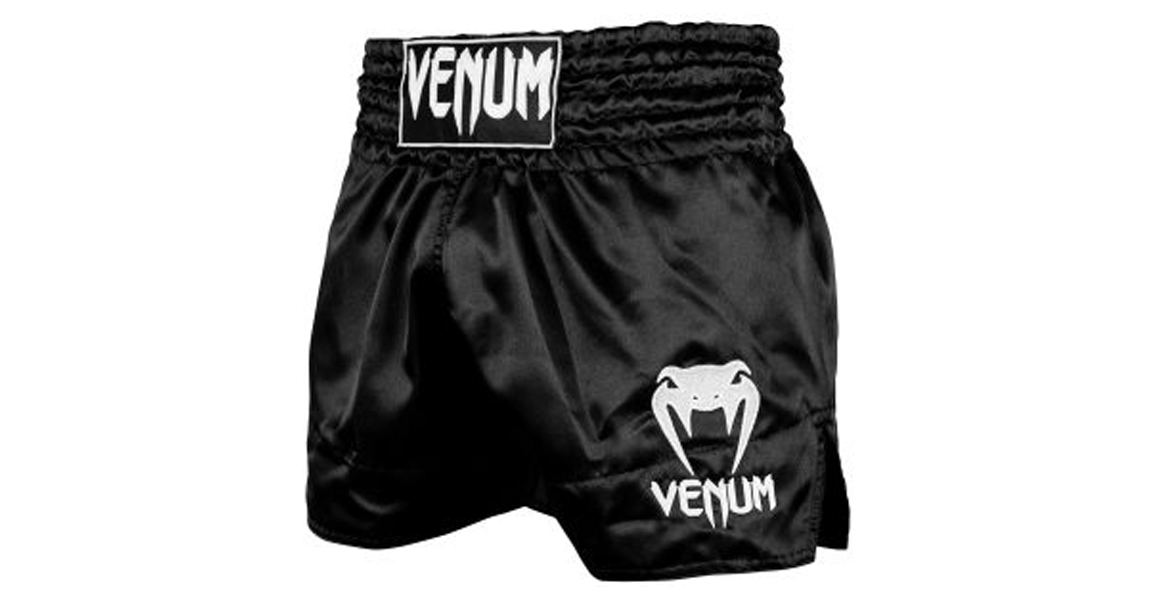 Venum Classic kickboxing shorts in black and white for kickboxing and Muay Thai training.