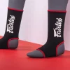 Fairtex AS3 Red Ankle Supports model wearing Muay Thai ankle guards