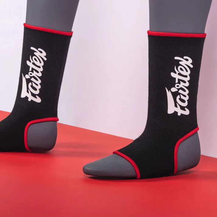 Fairtex AS3 Red Ankle Supports model wearing Muay Thai ankle guards