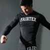 Fairtex RG9 Long Sleeve Rash Guard action shot model training in black compression rash guard
