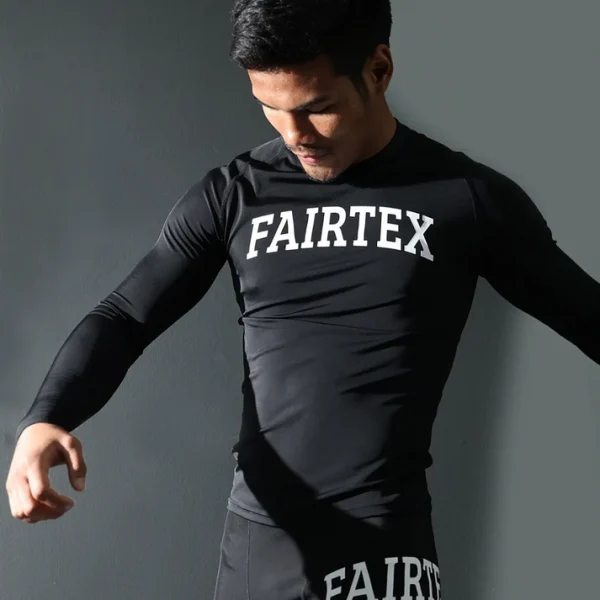 Fairtex RG9 Long Sleeve Rash Guard action shot model training in black compression rash guard
